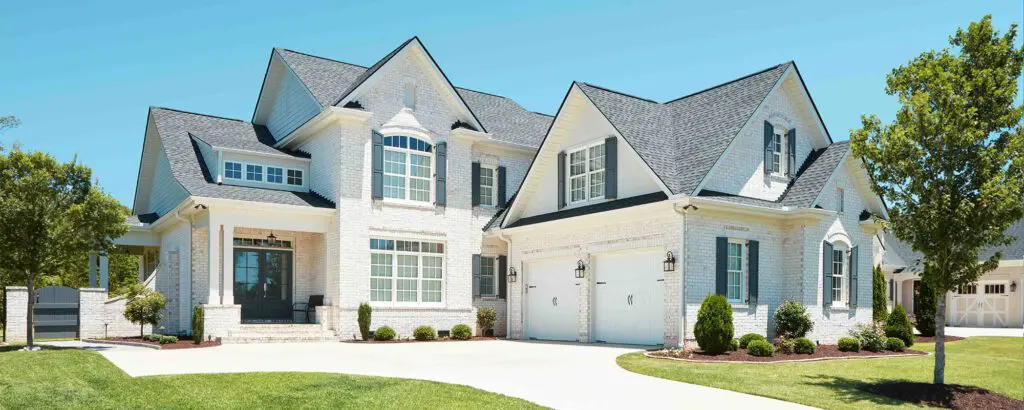 front view of a house with trees outside